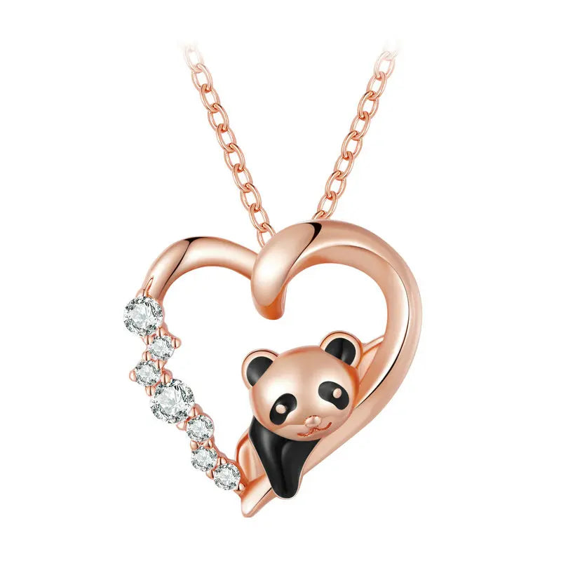 Rose gold-tone panda heart necklace close-up with black enamel accents and clear cubic zirconia stones
