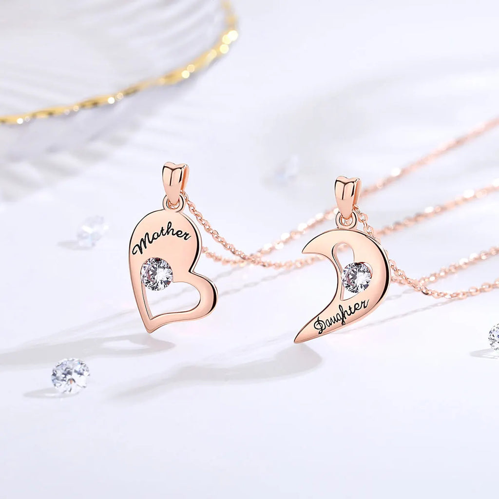 Rose gold-tone open heart and crescent pendants with black Mother and Daughter lettering
