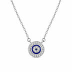 Round evil eye necklace in 925 sterling silver with blue concentric rings and clear cubic zirconia on white