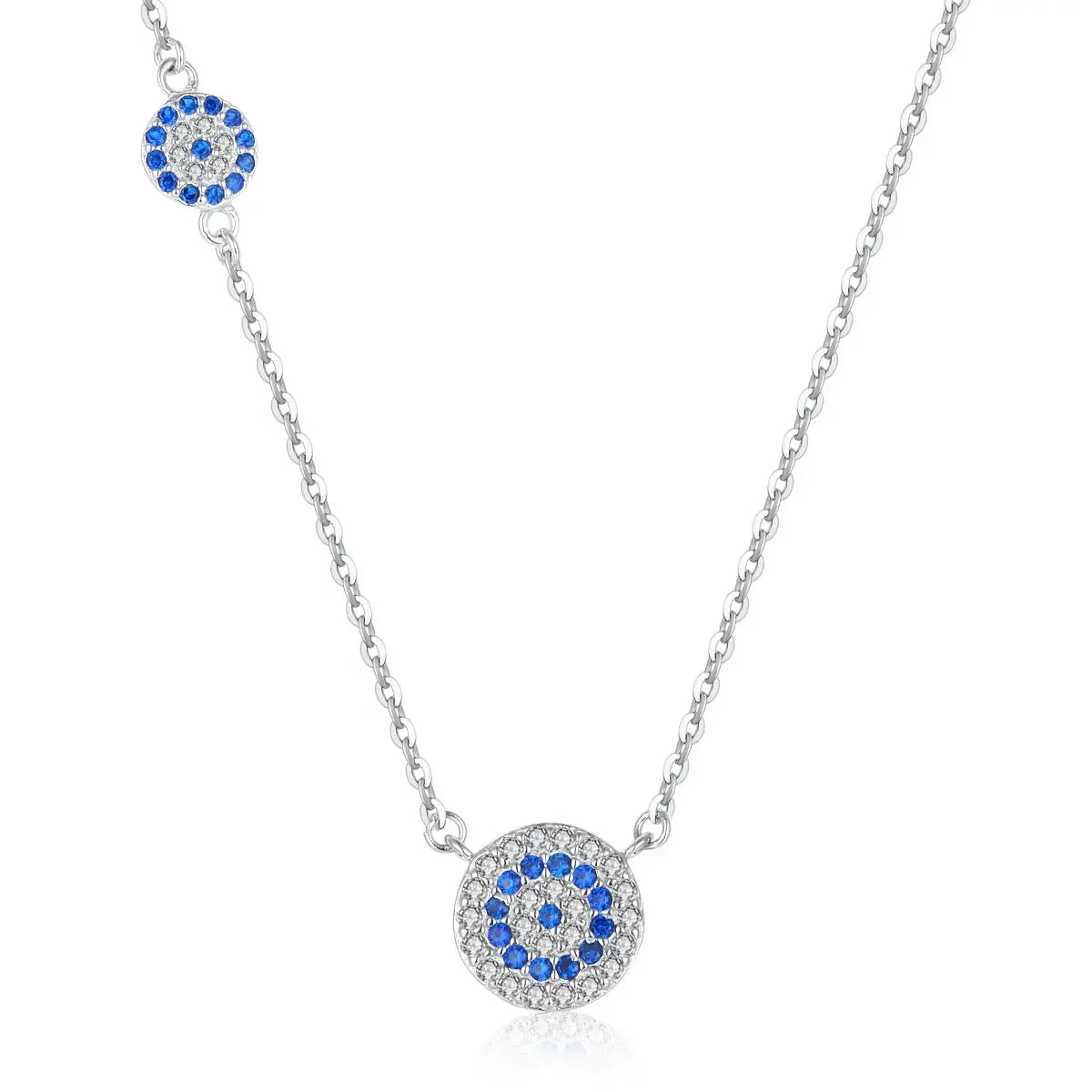 Silver-tone necklace with a centered blue evil eye medallion and smaller matching eye along the chain