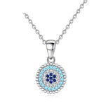 Beaded evil eye necklace in 925 sterling silver with light-blue, clear and dark-blue CZ stones on white