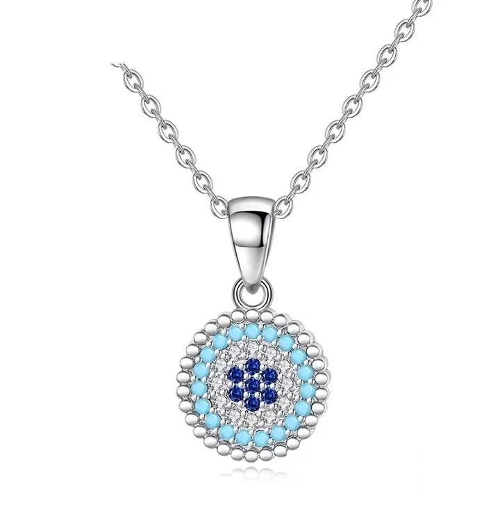Beaded evil eye necklace in 925 sterling silver with light-blue, clear and dark-blue CZ stones on white
