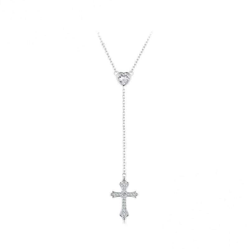 Y lariat silver cross necklace with a CZ heart connector and pointed cross on a white background