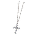 Silver-tone cross necklace with six clear cubic zirconia stones and a larger center stone on a white background