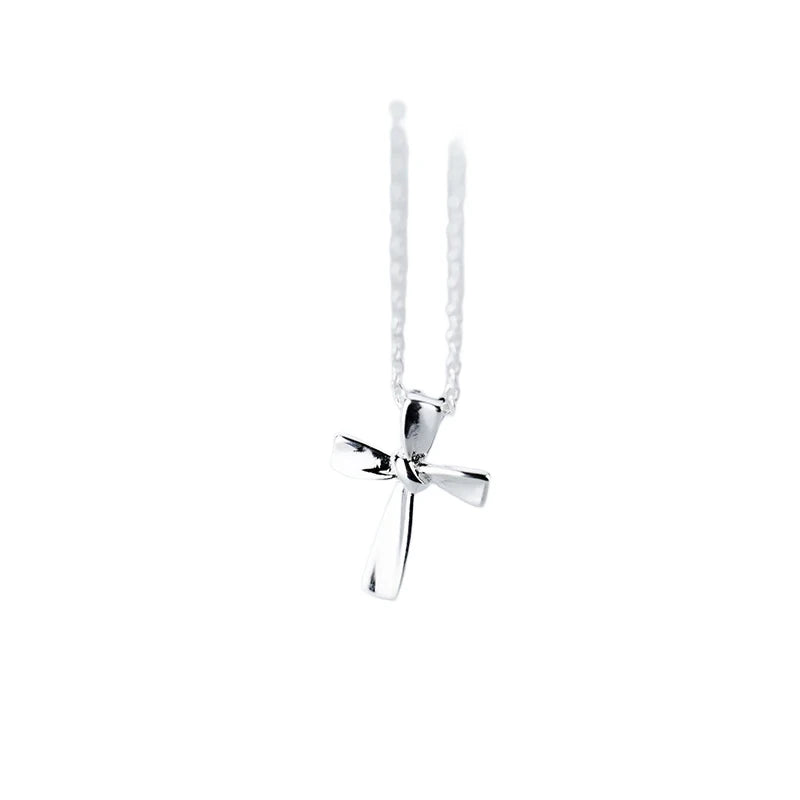 Silver-tone 925 sterling silver Latin cross pendant with a smooth tapered bail on a white background