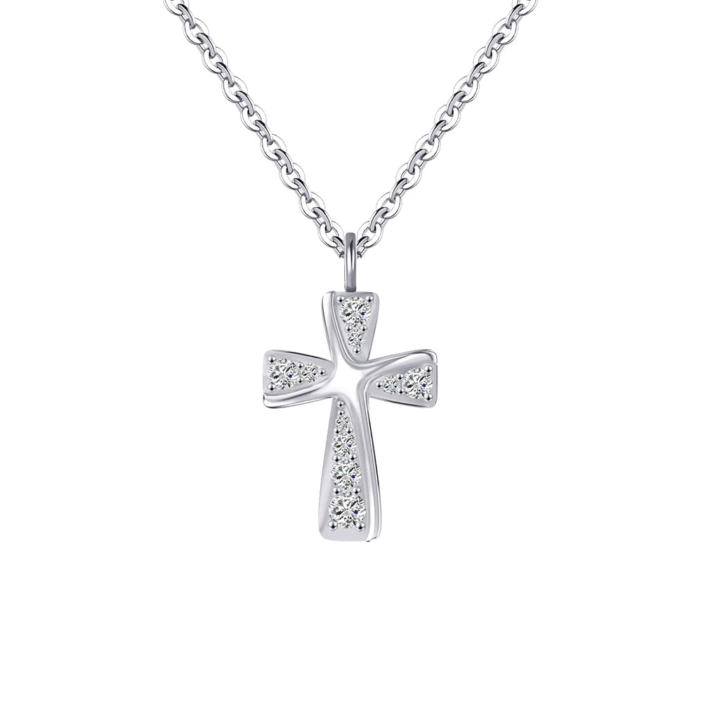 Curved silver cross necklace with clear CZ stones and raised center ridge on white
