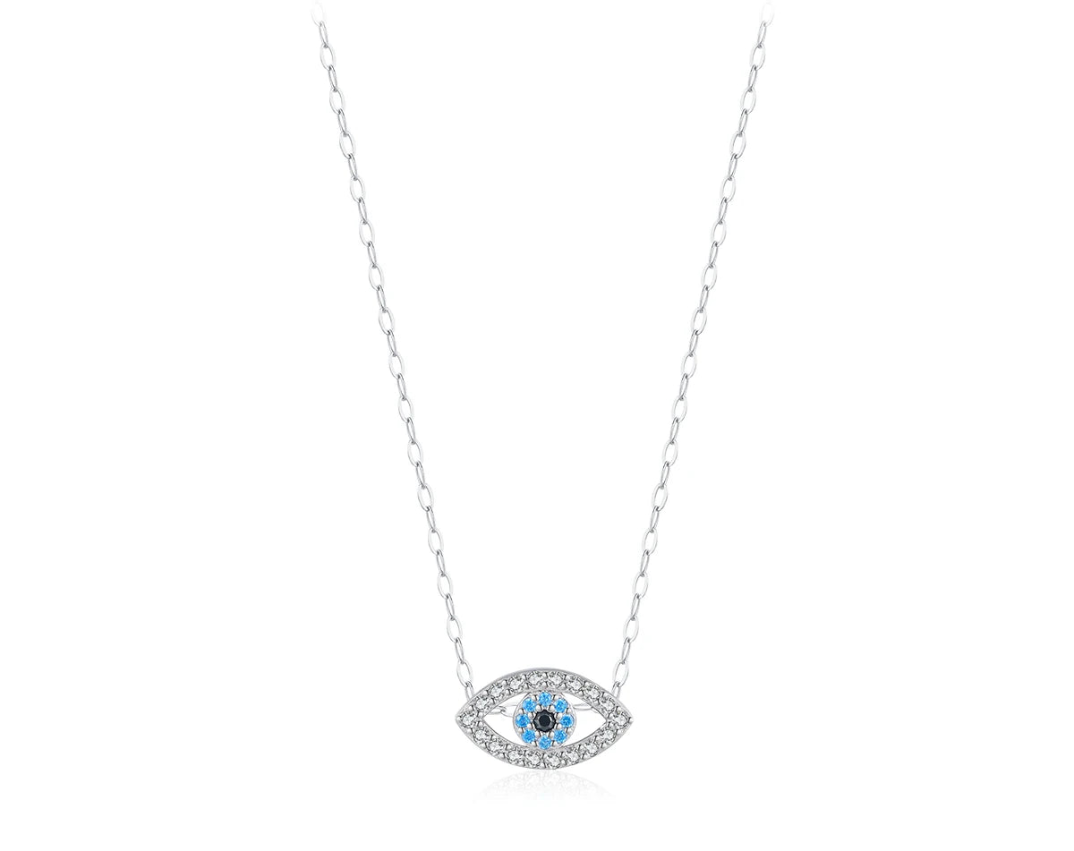 Silver-tone small evil eye necklace with clear outline stones and blue and black center stones on a white background