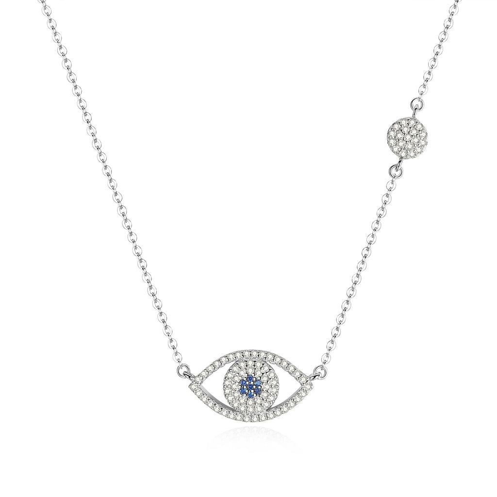 Silver-tone evil eye necklace on white with blue CZ center, clear CZ outline, and round station