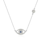 Silver-tone evil eye necklace on white with blue CZ center, clear CZ outline, and round station