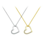 Asymmetrical open heart necklaces in silver-tone and gold-tone with clear CZ stone-set lower curves