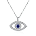 Silver-tone halo evil eye necklace with a round blue stone and two rows of clear CZ stones on white