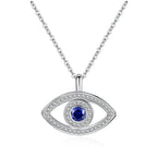Silver-tone halo evil eye necklace with a round blue stone and two rows of clear CZ stones on white