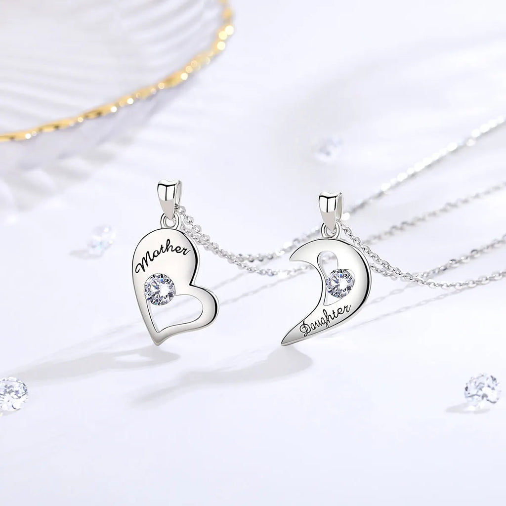 Silver-tone heart and crescent pendants showing Mother and Daughter black script with crystal stones