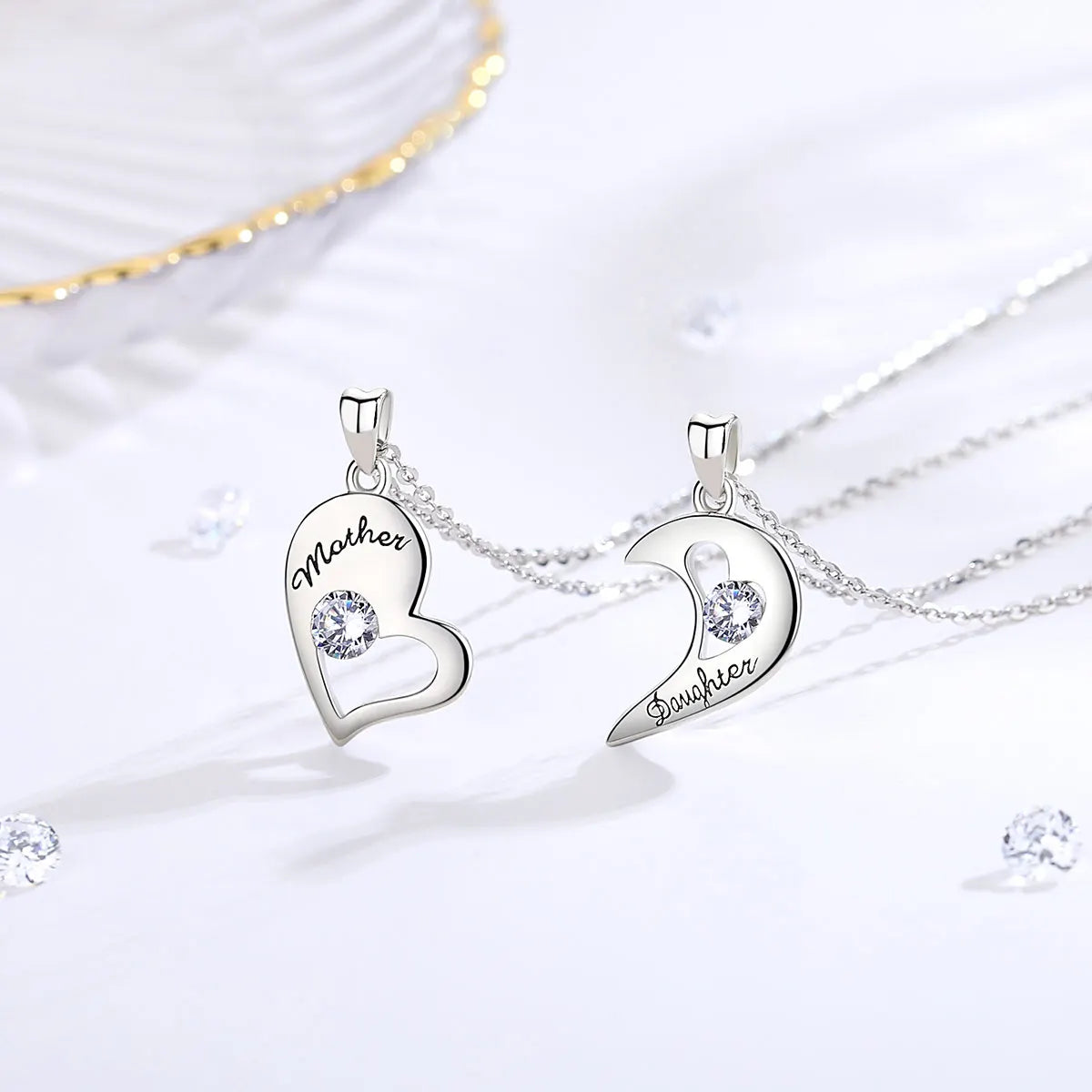 Silver-tone heart and crescent pendants showing Mother and Daughter black script with crystal stones