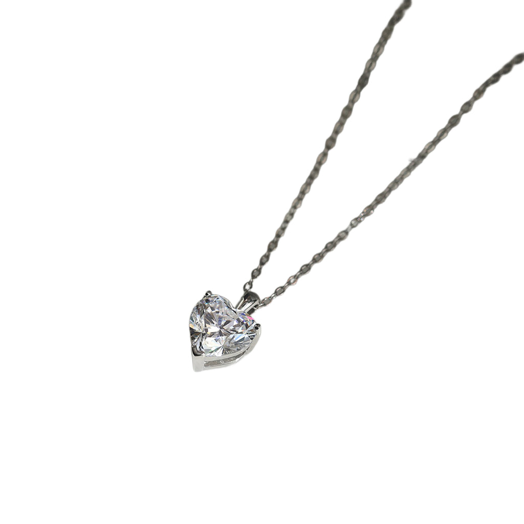 Silver-tone heart necklace with a clear faceted stone on a white background