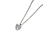 Silver-tone heart necklace with a clear faceted stone on a white background