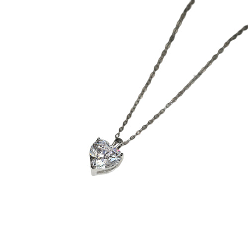 Silver-tone heart necklace with a clear faceted stone on a white background