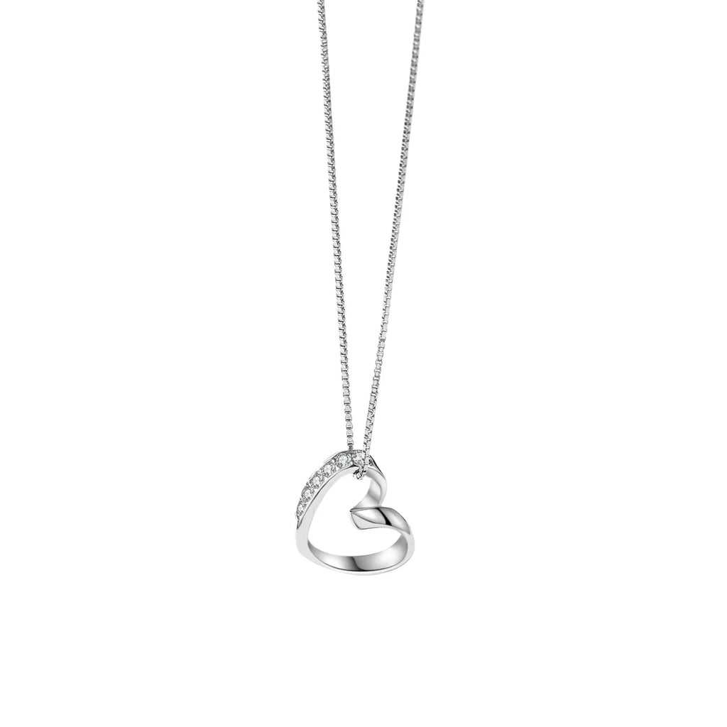 Close-up of a sterling silver open heart pendant with CZ stones on a white background