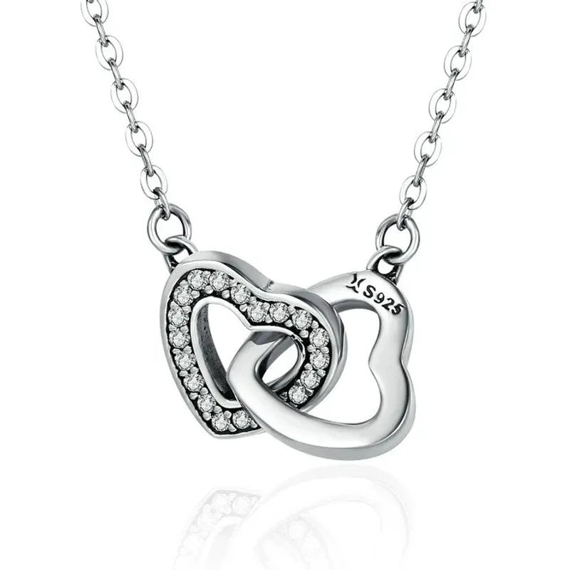 Interlocking heart necklace in 925 sterling silver with clear CZ stones and oval-link chain