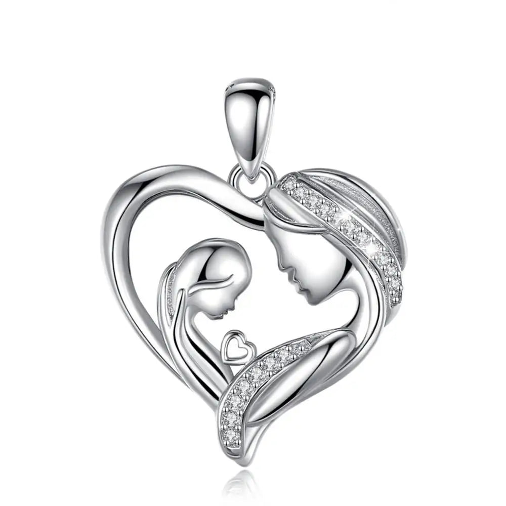 Silver-tone heart pendant close-up with sculpted profiles, open heart, and clear stones