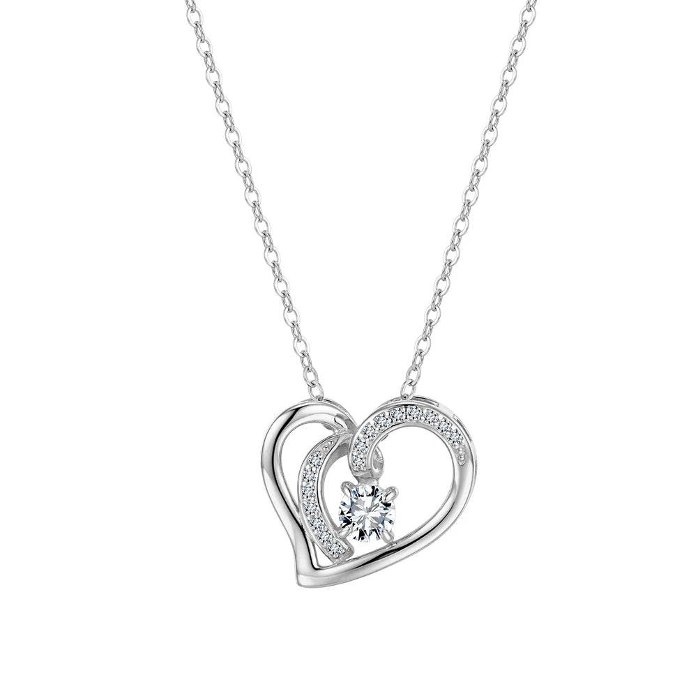Silver-tone overlapping heart necklace with a round moissanite center and stone-lined inner curve on white