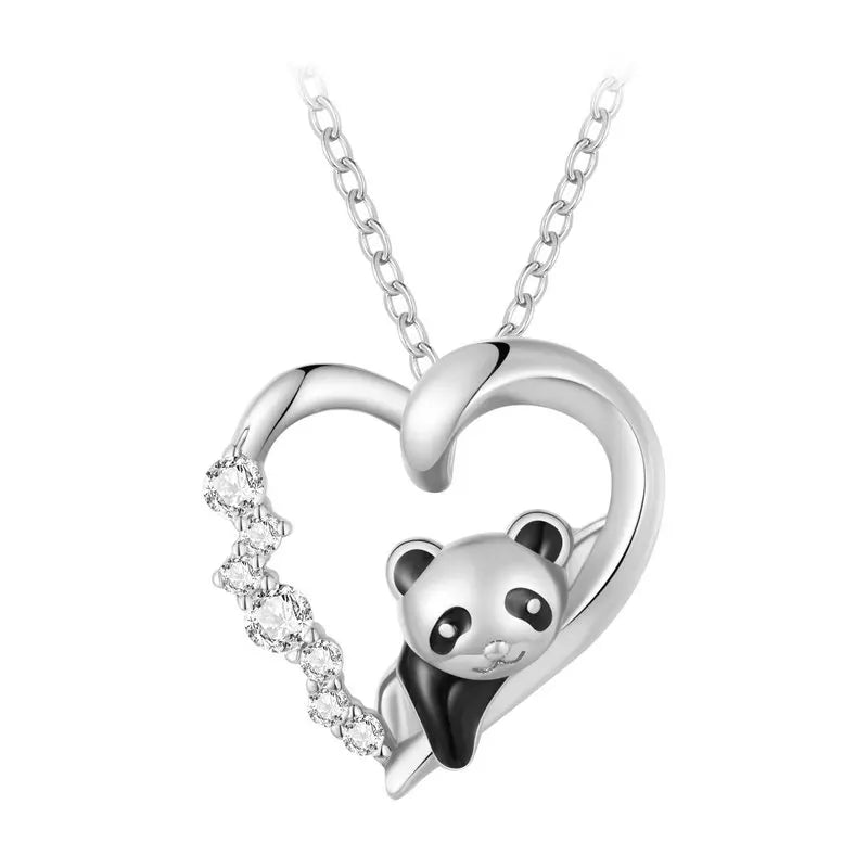 Silver-tone panda heart necklace close-up with black enamel panda and left-side cubic zirconia row