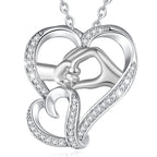 Silver-tone hand in hand heart necklace with clear CZ accents and a silver-colored chain on white