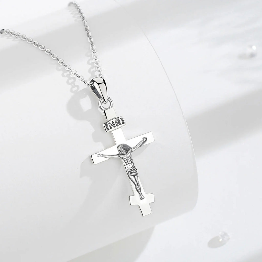 925 sterling silver crucifix necklace displayed on a white surface with a polished cross and INRI plaque