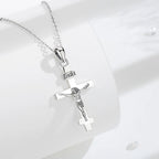 925 sterling silver crucifix necklace displayed on a white surface with a polished cross and INRI plaque