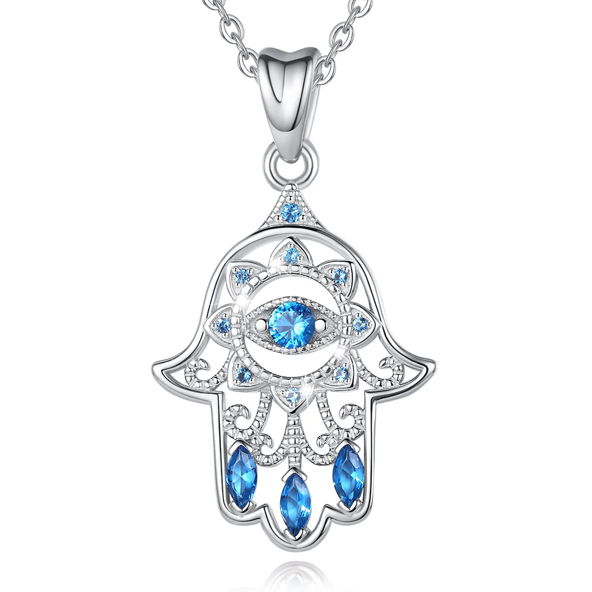 Sterling silver hamsa hand necklace on white with a faceted blue eye, petal details, and openwork scrolls