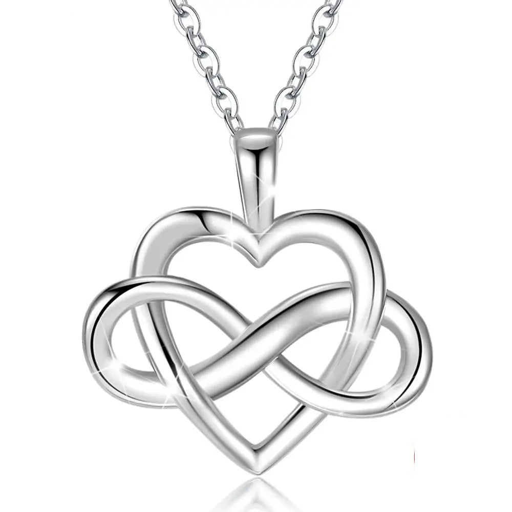 Infinity knot heart necklace in polished 925 sterling silver with an open heart and woven sideways loop