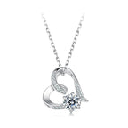 Open heart necklace in 925 sterling silver with a round moissanite and stone-set swirl on white
