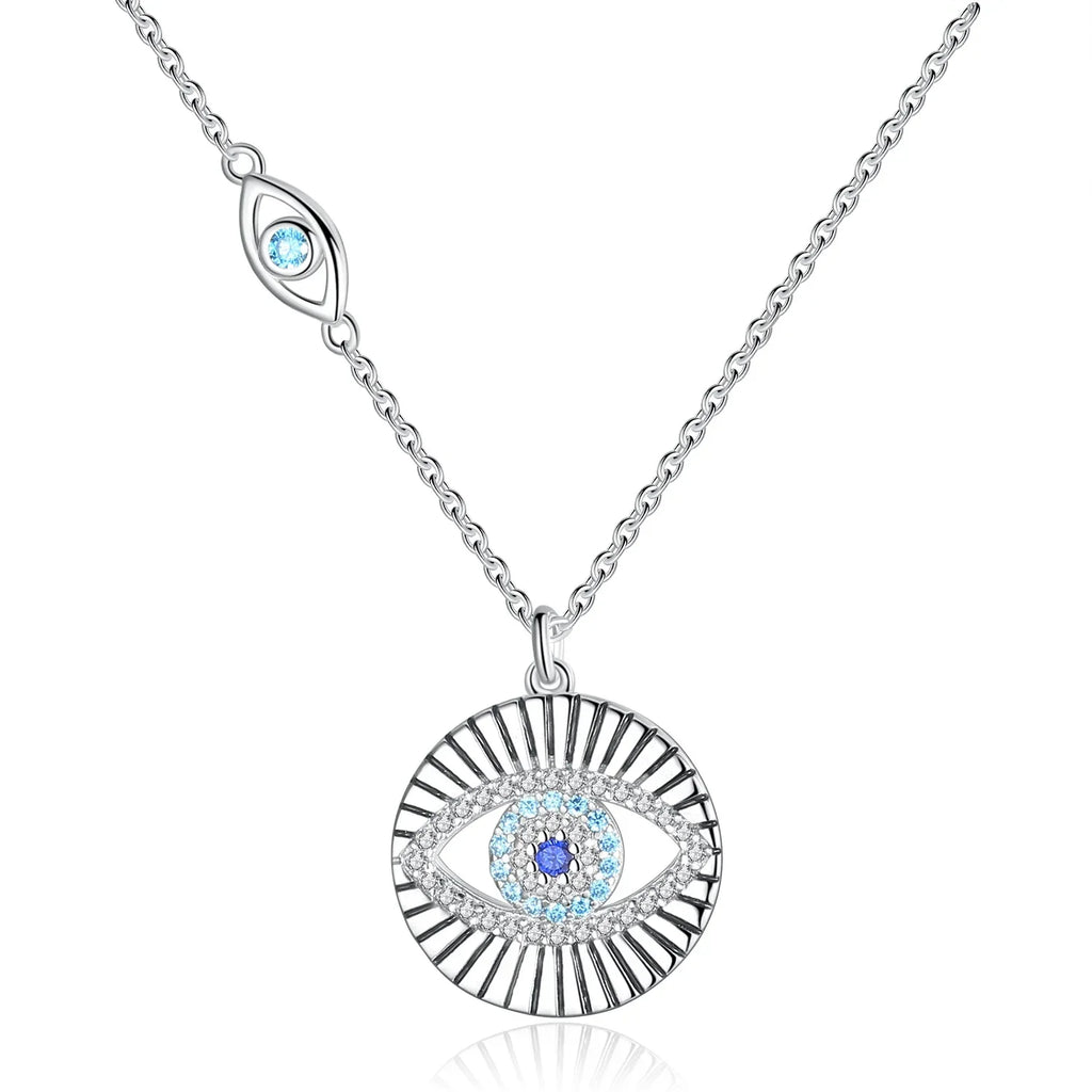 Sunburst evil eye necklace in 925 sterling silver with blue CZ stones on a white background