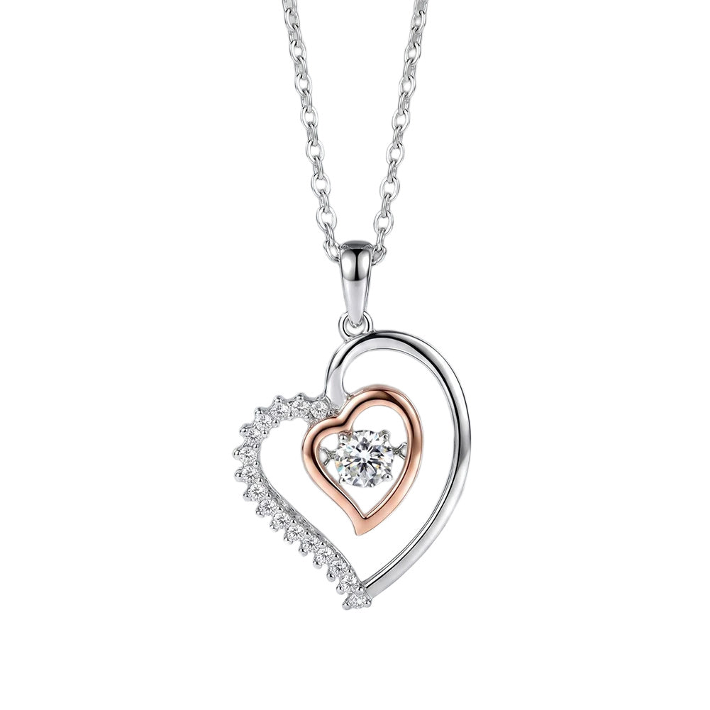 Two-tone heart pendant necklace on a white background with a clear cubic zirconia center stone