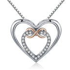 Front close-up of the silver-colored double-heart pendant with rose-gold-colored infinity loop and CZ stones