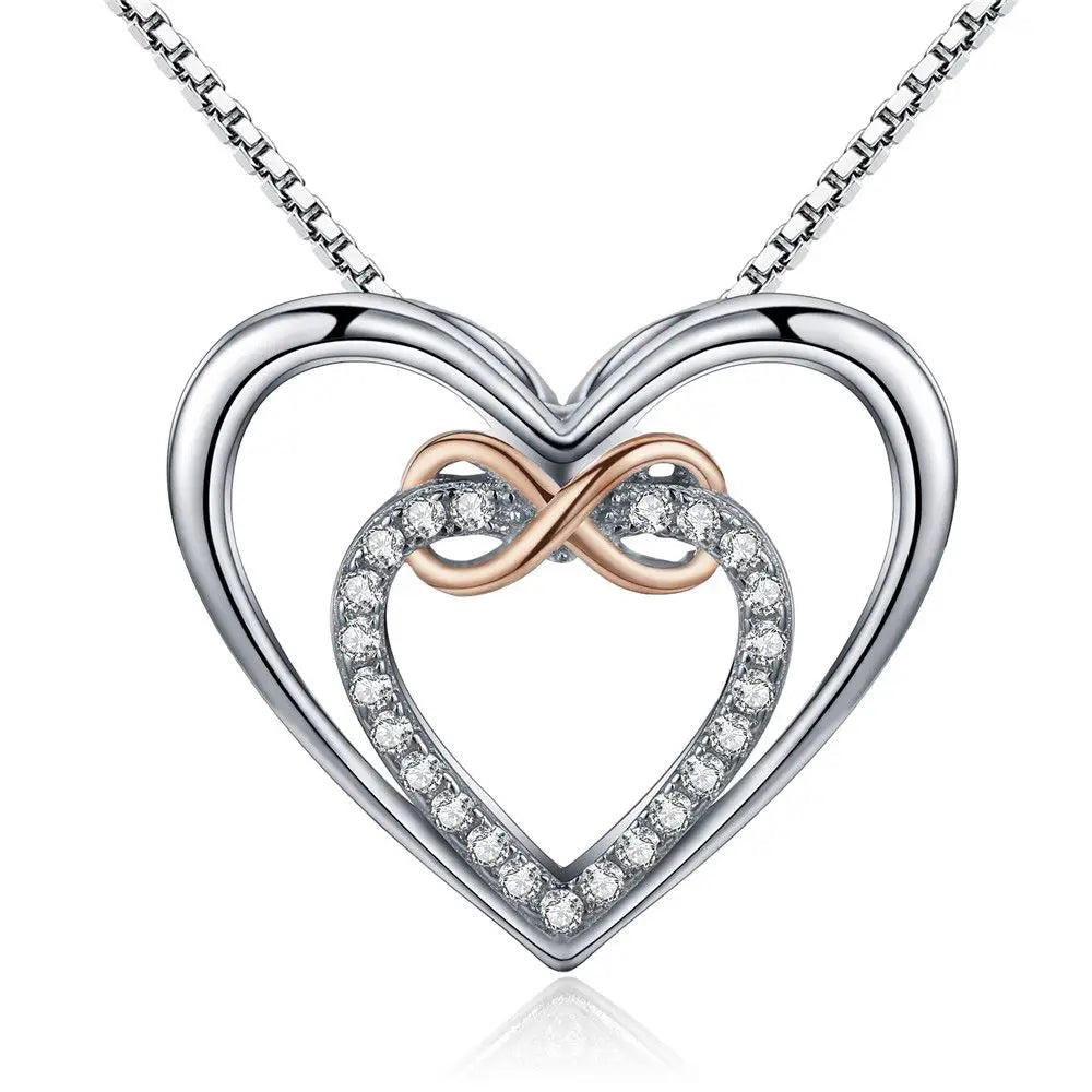 Front close-up of the silver-colored double-heart pendant with rose-gold-colored infinity loop and CZ stones