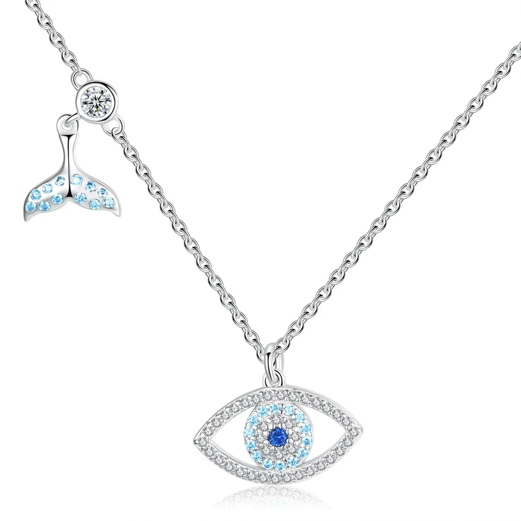 Whale tail evil eye necklace in 925 sterling silver with blue CZ stones on a white background