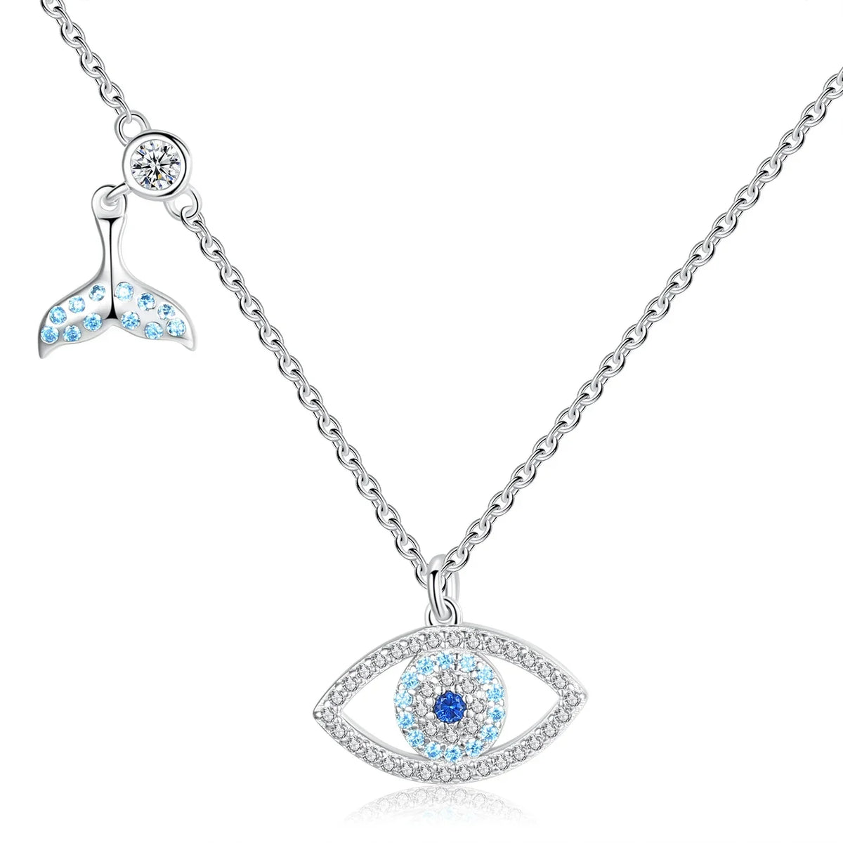 Whale tail evil eye necklace in 925 sterling silver with blue CZ stones on a white background