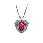 Winged heart necklace in 925 sterling silver with a faceted red CZ heart on a white background